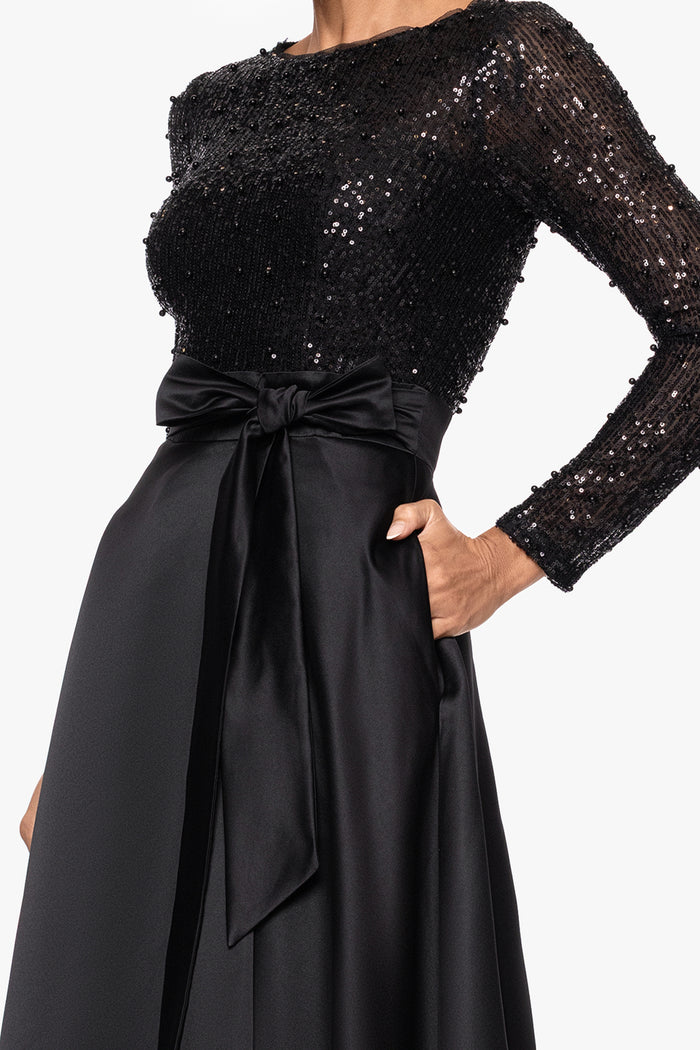 Black “Isabel” Satin Skirt and Sequin Bodice Long Sleeve Dress, sequin bodice, long sleeves, and satin bow waist detail