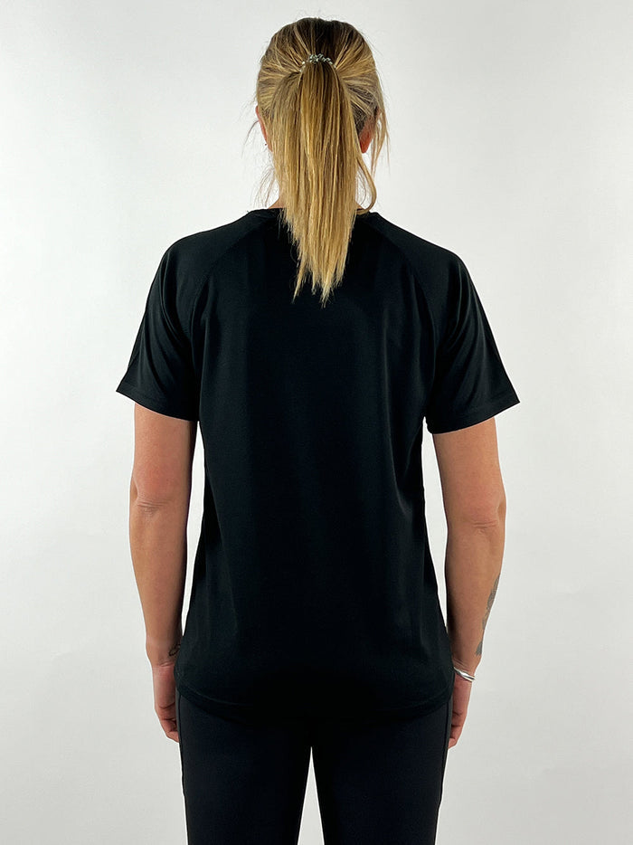Back view of a woman wearing a black active llama t-shirt designed for comfort and quick drying during workouts