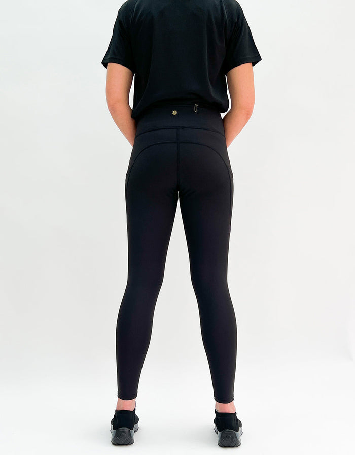 Black Magic Activewear black leggings with pockets shown from the back on a person