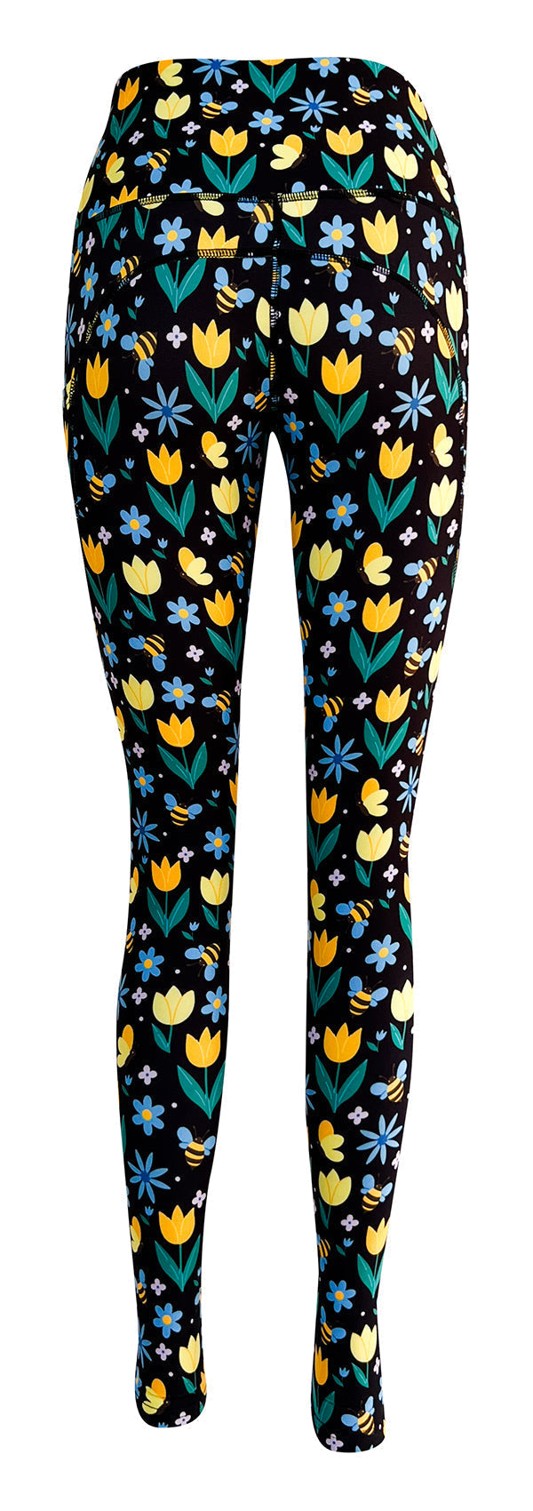 Black leggings with vibrant yellow tulips, blue forget-me-nots, white daisies, and bumblebee print, featuring deep side pockets and a high-rise waistband.