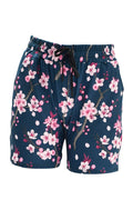 Slim fit cherry blossom jogger shorts with elastic waistband and drawstring on navy background