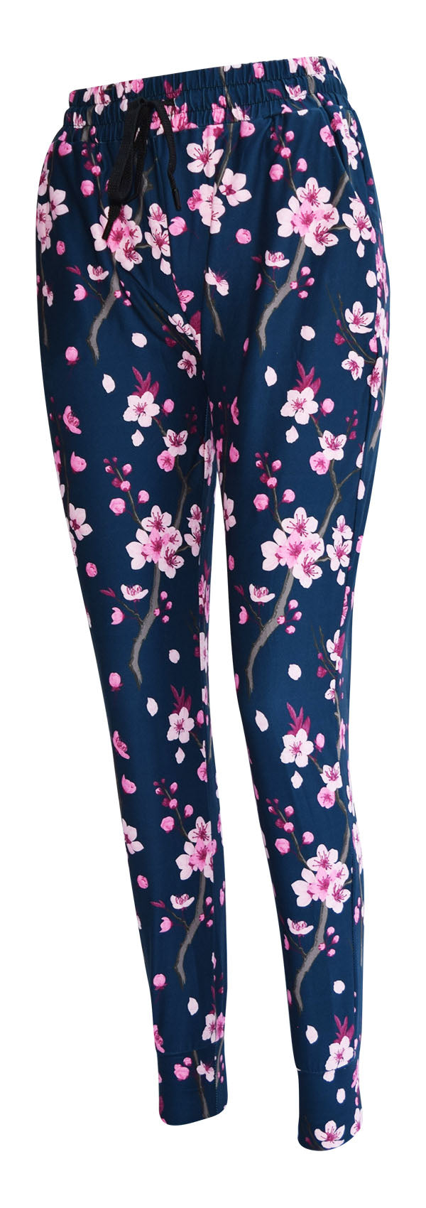 Slim fit cherry blossom joggers with pink flowers on dark blue background, featuring cuffed bottoms, drawstring waist, and pockets.
