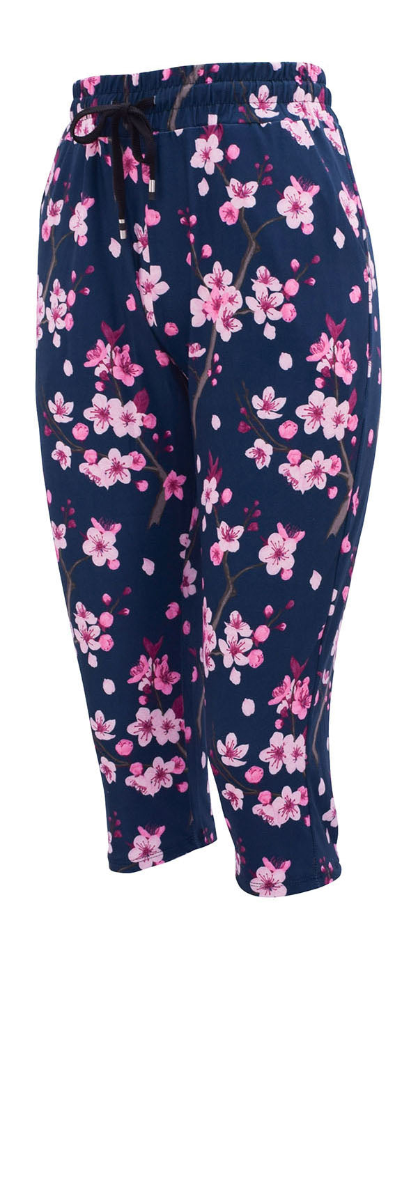 Slim fit cherry blossom joggers with pink flowers on dark blue background, cuffed bottoms, drawstring waist, and pockets.