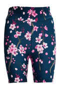 Tight shorts with cherry blossom floral print in navy blue, featuring elastic waistband and stretchy fabric for a comfortable, flattering fit.