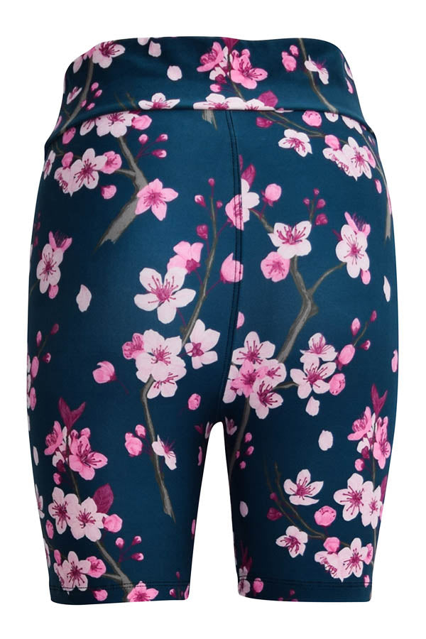 Tight shorts with a navy background and delicate pink cherry blossom floral print, featuring a high elastic waistband and a snug, stretchy fit.