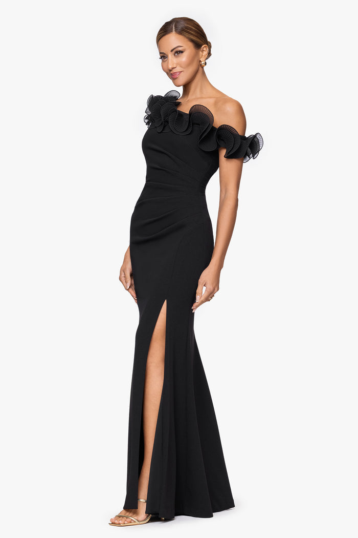 Black “Delilah” Scuba Crepe Drop Shoulder Chiffon Ruffle Dress, angled three-quarter view with side slit