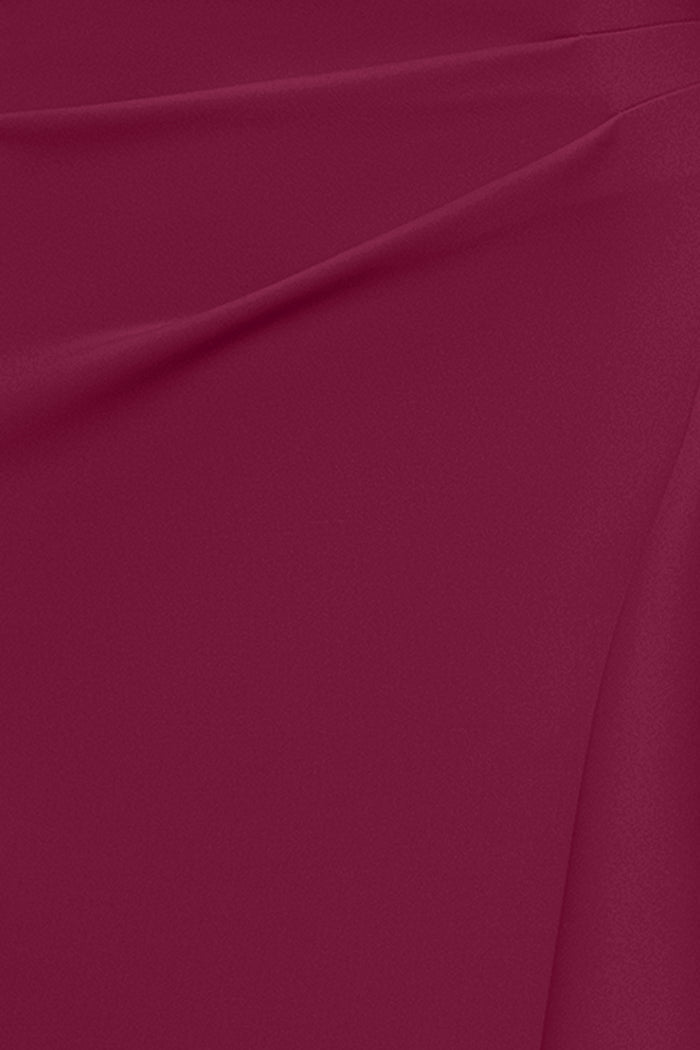 Close-up of the techno scuba fabric in wine on the Dolly techno scuba off the shoulder ruffle dress.