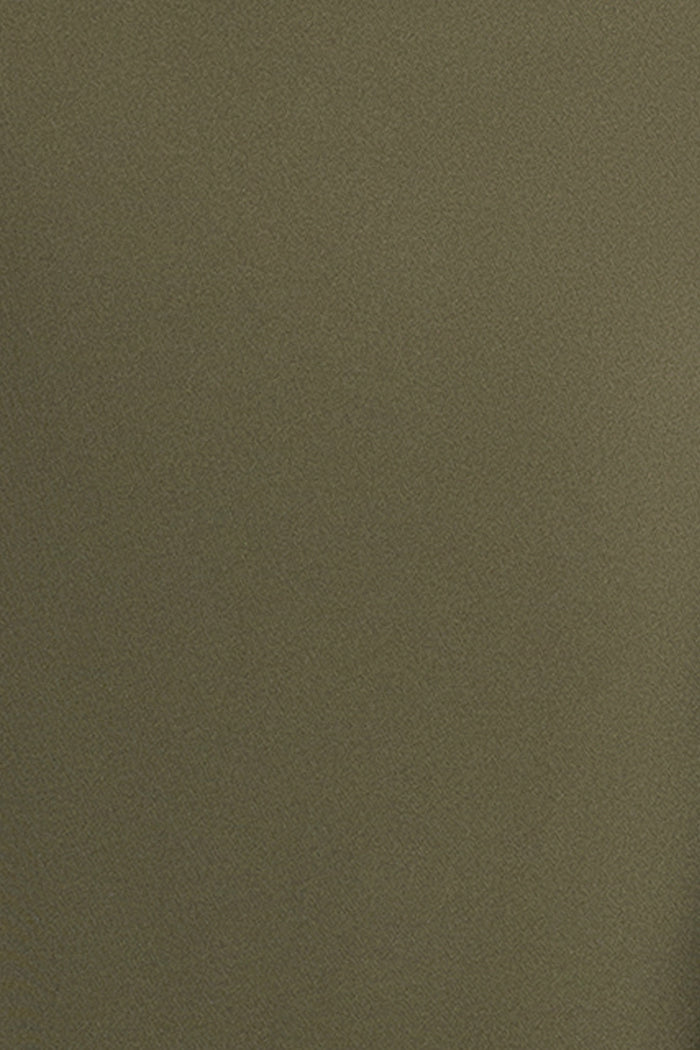 Close-up of the techno scuba fabric in olive on the Dolly techno scuba off the shoulder ruffle dress.