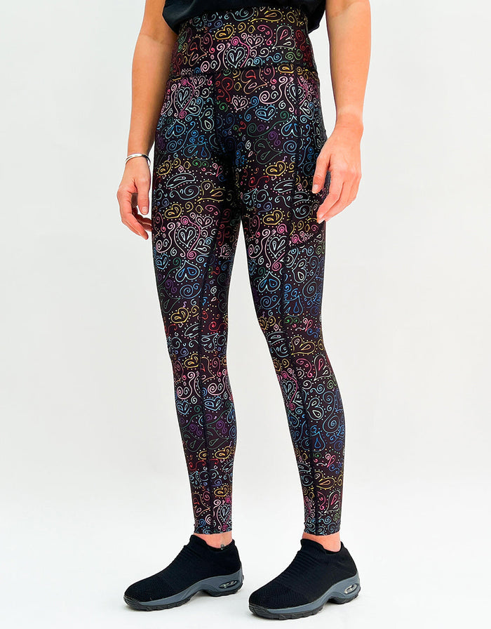 Colorful heart doodle print high-waisted gym leggings with side pockets and breathable four-way stretch fabric.