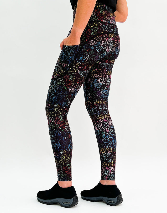 Colorful heart doodle gym leggings with side pockets and high-waisted fit for activewear