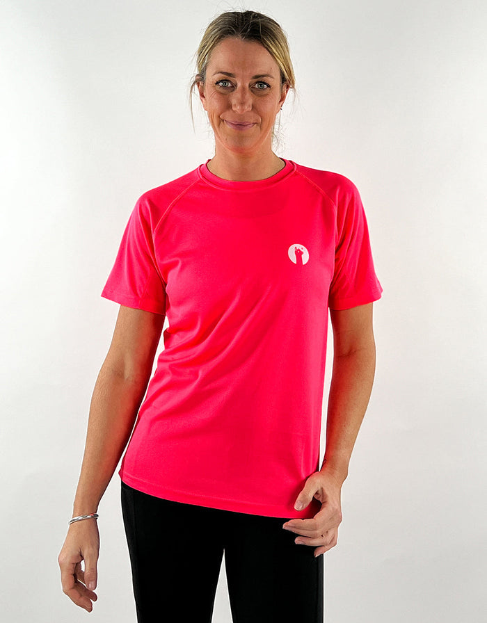 Electric pink active t-shirt with breathable, quick-drying fabric worn by woman