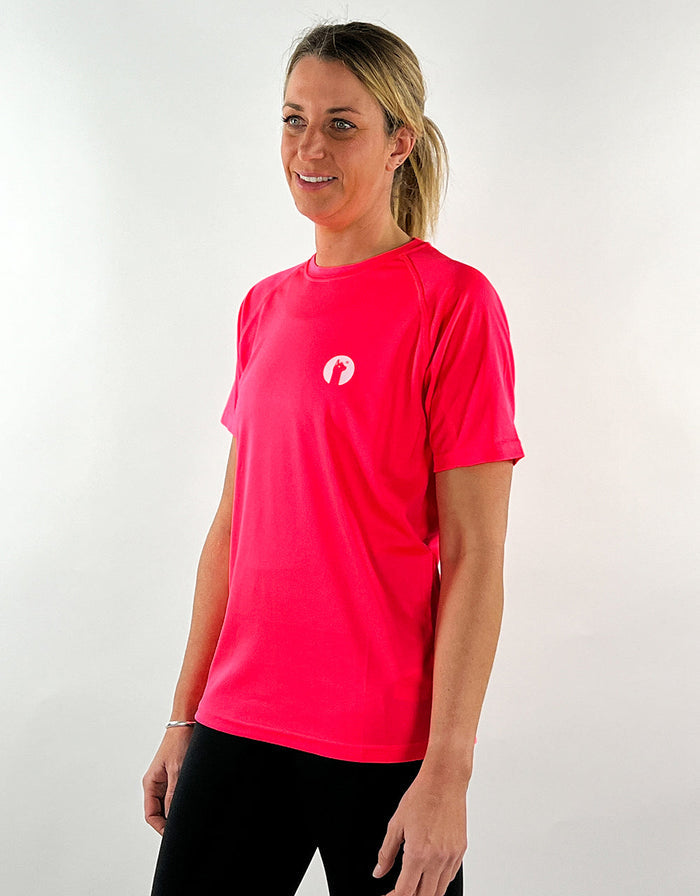 Electric pink active t-shirt worn by woman, breathable and quick drying workout top