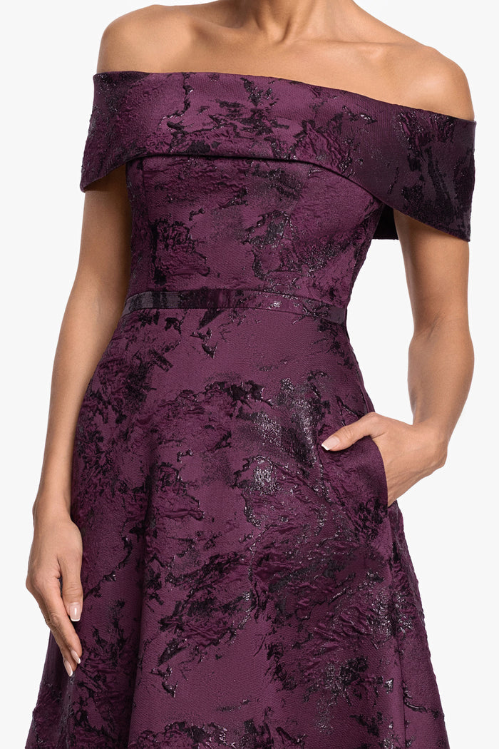 Plum “Emily” Printed Brocade Off The Shoulder Gown, folded off-the-shoulder neckline and fitted bodice detail