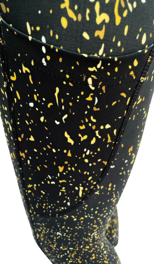 Black leggings with gold, yellow, and white flecks featuring deep side pockets and extra stitching for structure