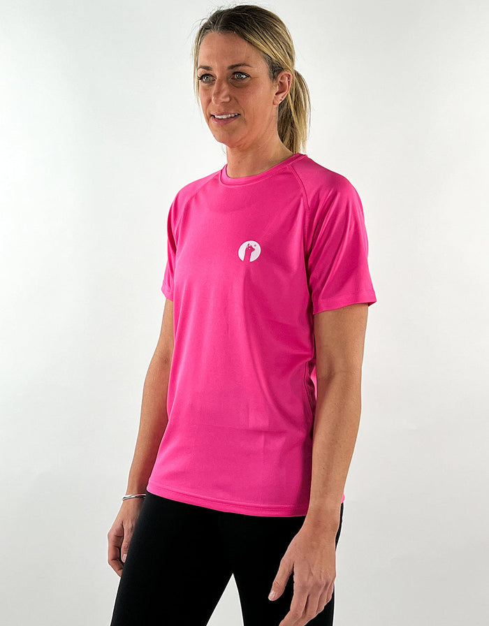 Woman wearing hot pink breathable active t-shirt with small logo on chest