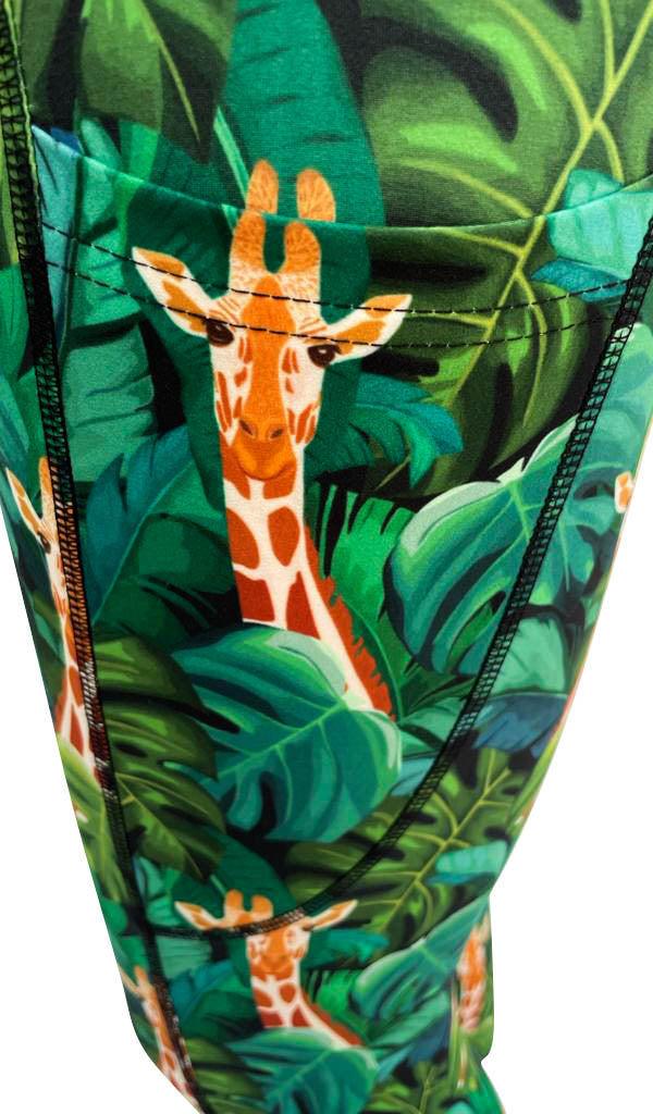 Close-up of Jungle Giraffe + Pockets leggings featuring soft fabric, deep side pockets, structured stitching, and vibrant jungle print with giraffes and green leaves.