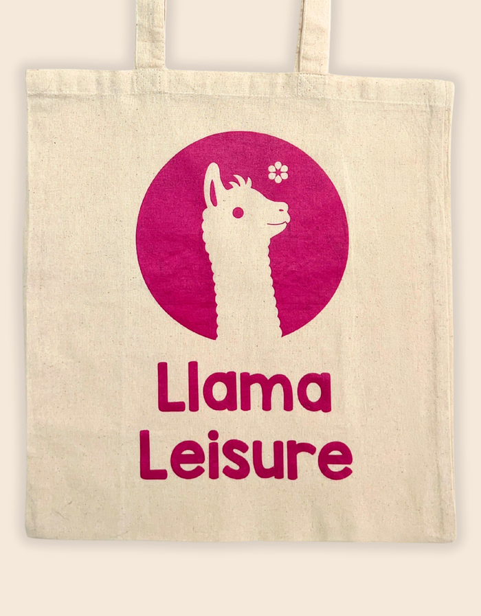 Beige llama tote bag with magenta llama graphic and "Llama Leisure" text