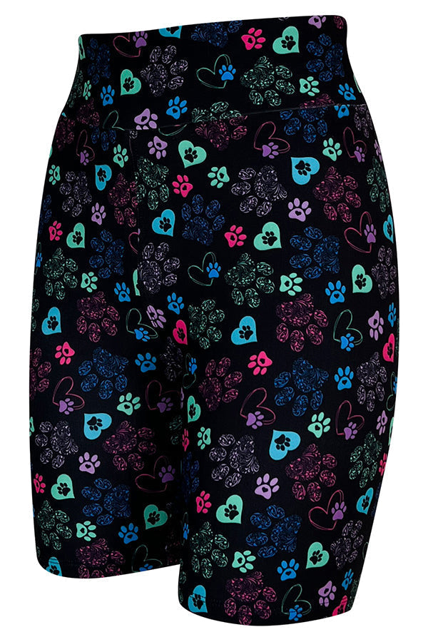 Black tight shorts with colorful heart and paisley paw prints, breathable stretch fabric, high waistband for comfort and support.