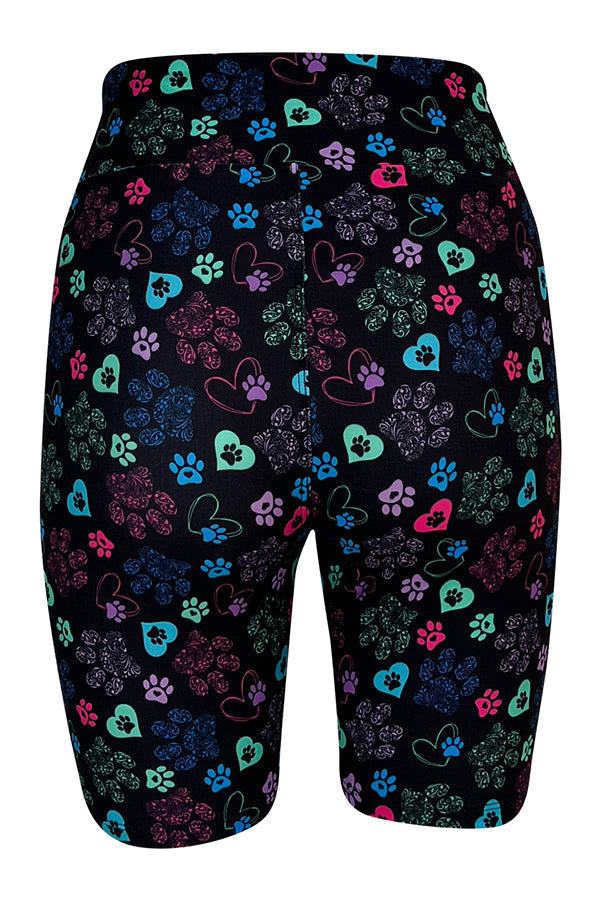 Black tight shorts with colorful hearts and paisley paw prints, breathable stretch fabric for comfort and performance