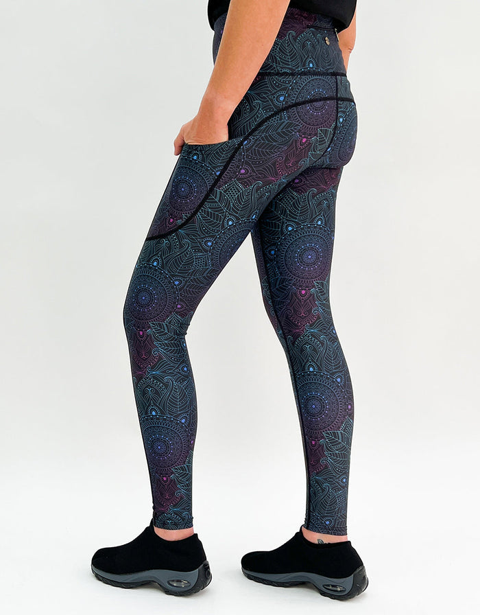 Woman wearing Midnight Mandala Activewear leggings with subtle mandala pattern and pockets
