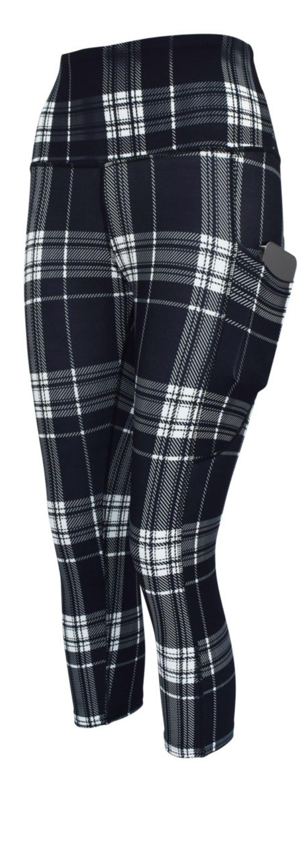 Monochrome tartan leggings with pockets in classic black and white plaid pattern, stretch fabric, and a slim fit design