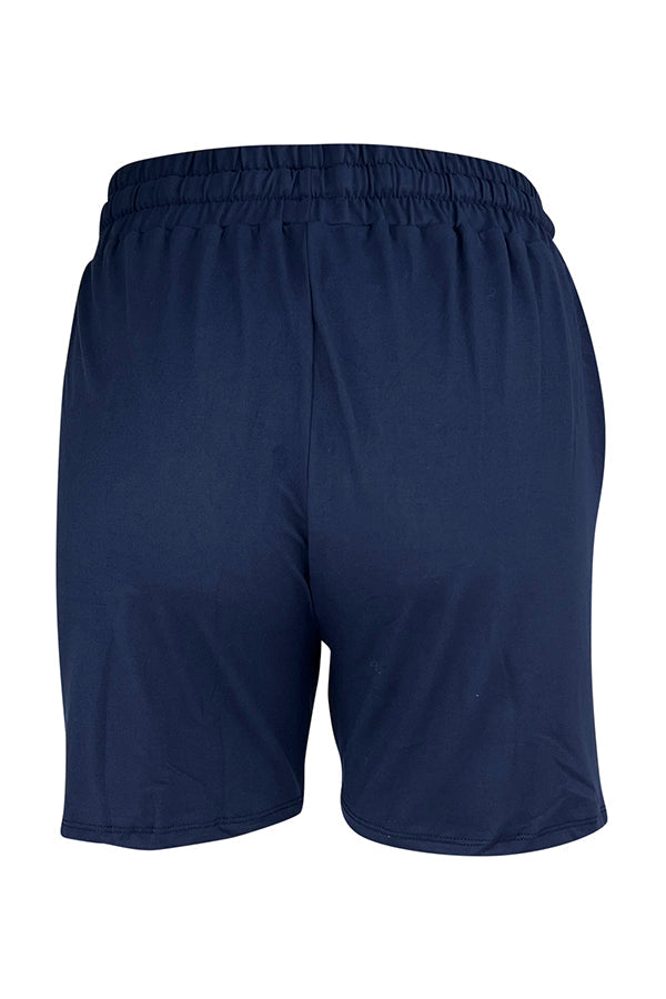 Back view of navy magic stretch fabric jogger shorts with elastic waistband and deep side pockets