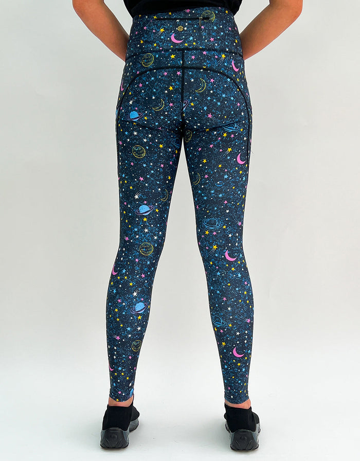 Back view of "Out Of This World" activewear leggings with intergalactic print and pockets
