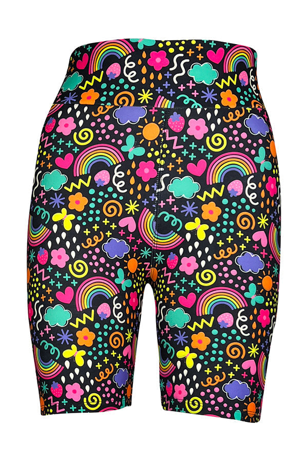 Colorful tight shorts with vibrant rainbow and multicolored doodle pattern on black background