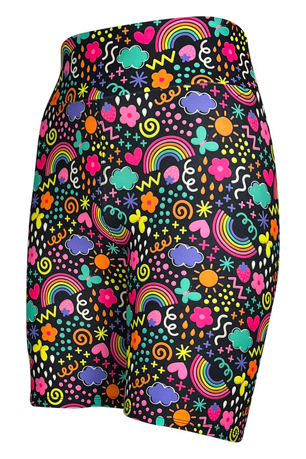Colorful tight shorts with vibrant rainbow and multicolored doodle pattern on black background