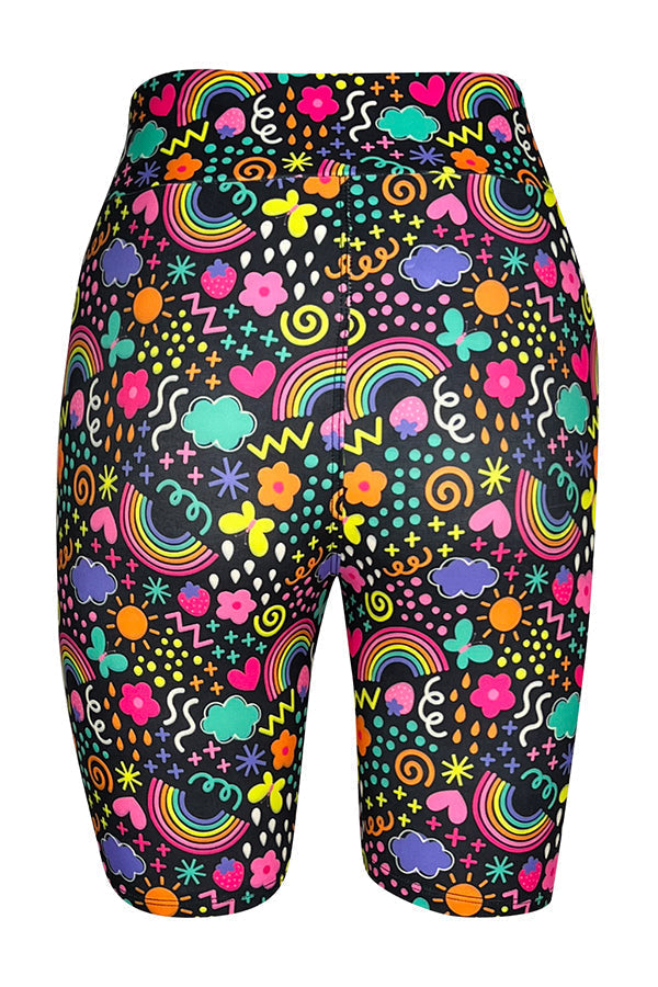 Tight shorts with vibrant rainbow and multicolored doodle pattern on black background.
