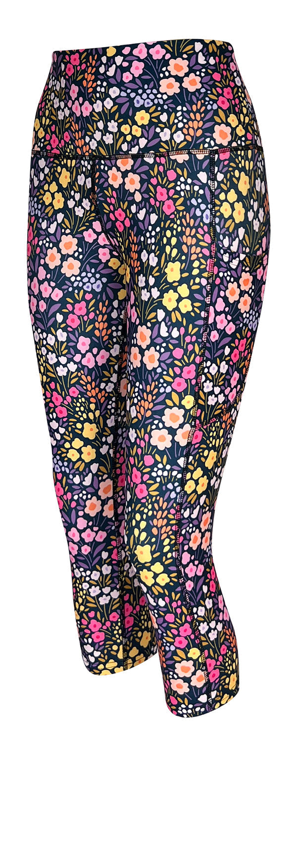 Floral leggings with pockets featuring pastel petals on dark background with high-rise waistband