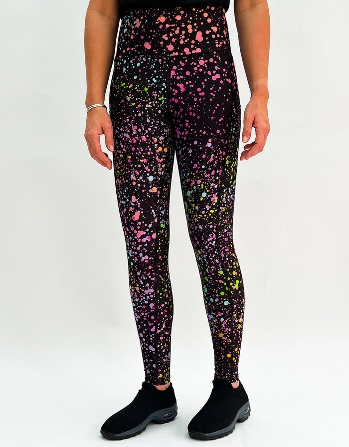 Pink galaxy print gym leggings with side pockets and high waist, designed for comfort and performance.