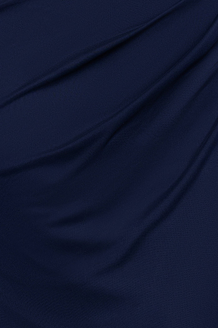 Close-up of the Navy sheer matte jersey fabric and draping