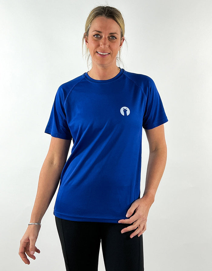 Woman wearing royal blue active llama t-shirt with breathable, quick-drying fabric paired with black leggings