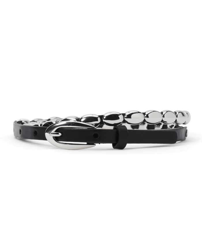 The Beaded Belt in black with silver by THE GREAT. F26 STETSON features top-grain leather adorned with oval silver metal accents and a silver buckle, shown against a white background.