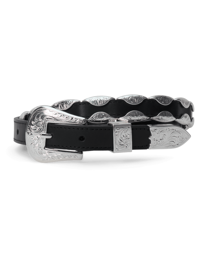The Western Hardware Belt by THE GREAT. F26 STETSON in black with silver features a top-grain leather strap adorned with decorative silver details and an embossed silver-tone buckle, shown coiled on a white background.