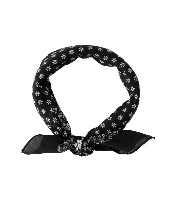 Introducing The Bandana - Small by THE GREAT. SP24 D2, in an Almost Black shade with white floral patterns, tied in a knot and crafted from 100% cotton for an ultra-soft feel, reminiscent of vintage handkerchiefs.