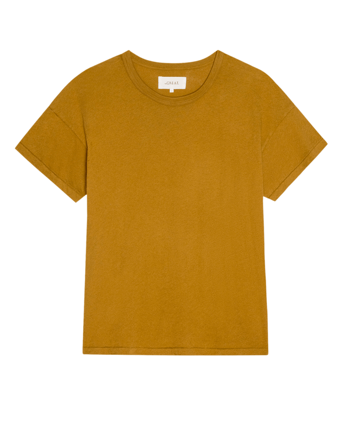 The Boxy Crew. Solid -- Cork by THE GREAT. SU26 SEASONAL CORE is a mustard yellow women’s crewneck t-shirt with short sleeves and a boxy cut, shown on a white background.