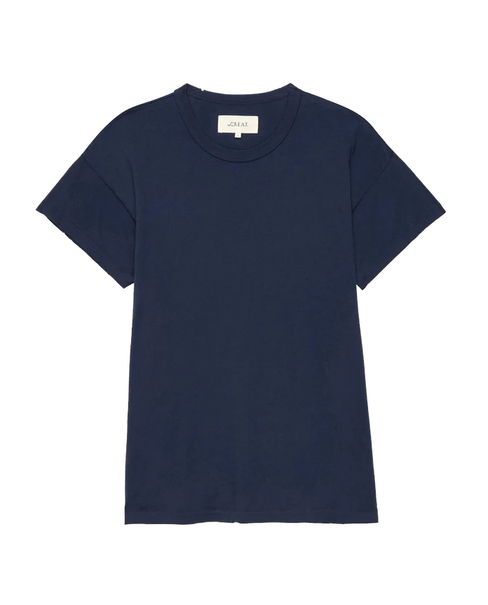 The Boxy Crew in True Navy by THE GREAT. FALL 23 KNITS is a locally handcrafted, 100% cotton T-shirt featuring short sleeves and a round neckline, displayed against a white background.