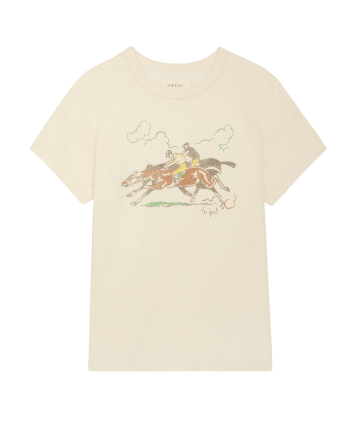 The Boxy Crew w/ Derby Graphic in Washed White by THE GREAT. PF26 showcases a vintage line drawing of two jockeys on horses with green grass and clouds—crafted in signature Los Angeles style for a unique look.