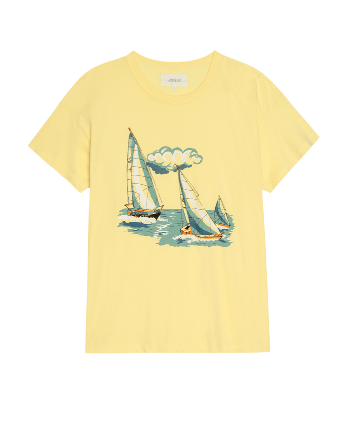 The Boxy Crew W/ Sailing Boats Graphic – Sunbeam by THE GREAT. SU26 is a yellow crewneck tee with a boxy fit, featuring a graphic of three sailing boats on the water beneath a cloud.