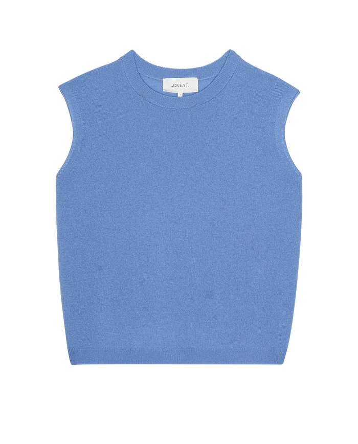 The Cashmere Pullover Vest in Soft Blue by THE GREAT. PS26, a sleeveless crew-neck knit sweater vest with vintage menswear vibes, is displayed flat on a white background.