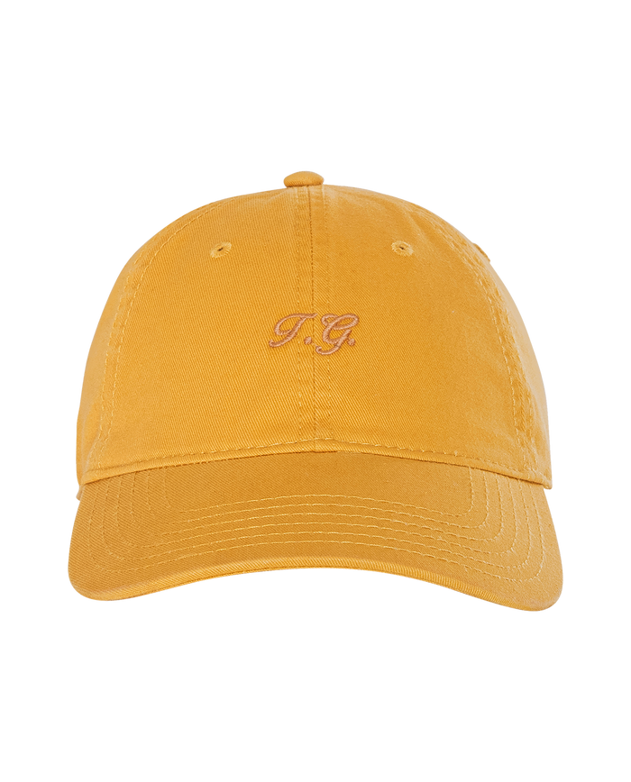 The Classic Baseball Hat in bright yellow by THE GREAT. H25 BRIGHT FLEECEBACK features vintage-style pink "P.G." embroidery on the front—ideal for everyday wear or as a thoughtful holiday gift.
