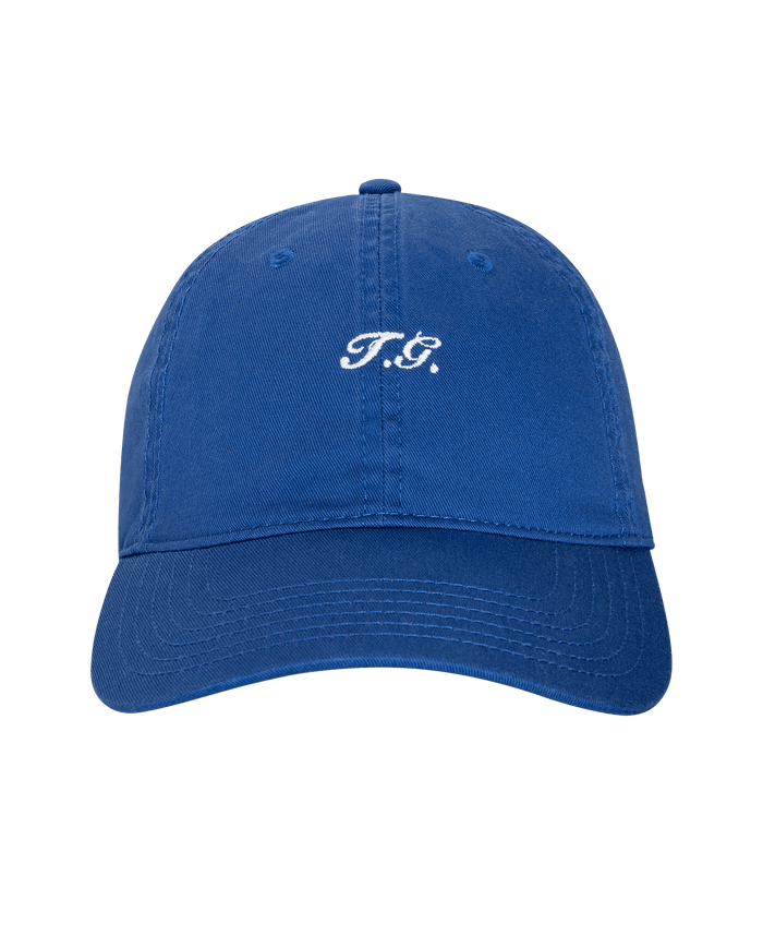 The Baseball Hat in cobalt by THE GREAT. SU26 features “T.G.” embroidered in white on the front and is shown against a plain white background.