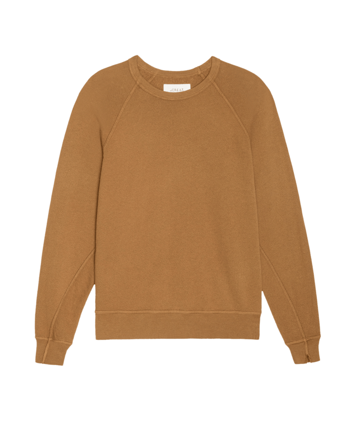 The College Sweatshirt by THE GREAT. SU26 SEASONAL CORE in Solid Cork features a crewneck, long sleeves, and ribbed cuffs and hem, shown laid flat on a white background.