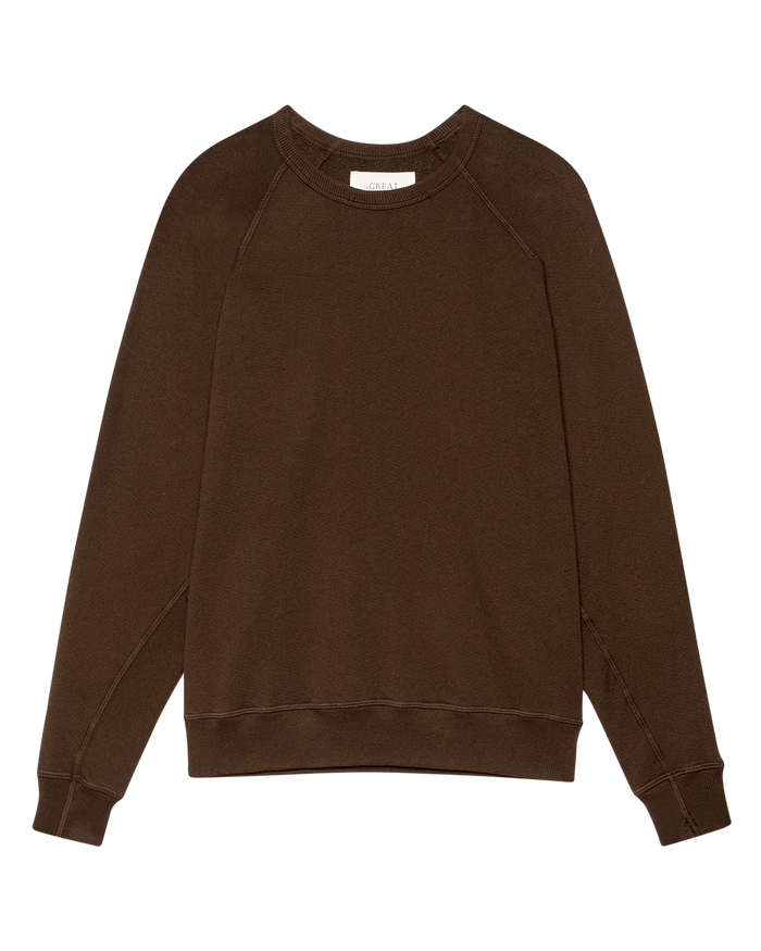 Laid flat on a white background, The College Sweatshirt in Solid -- Driftwood by THE GREAT. F26 SEASONAL CORE showcases effortless vintage-inspired style with its oversized silhouette and long-sleeve crewneck design, handcrafted in Los Angeles.