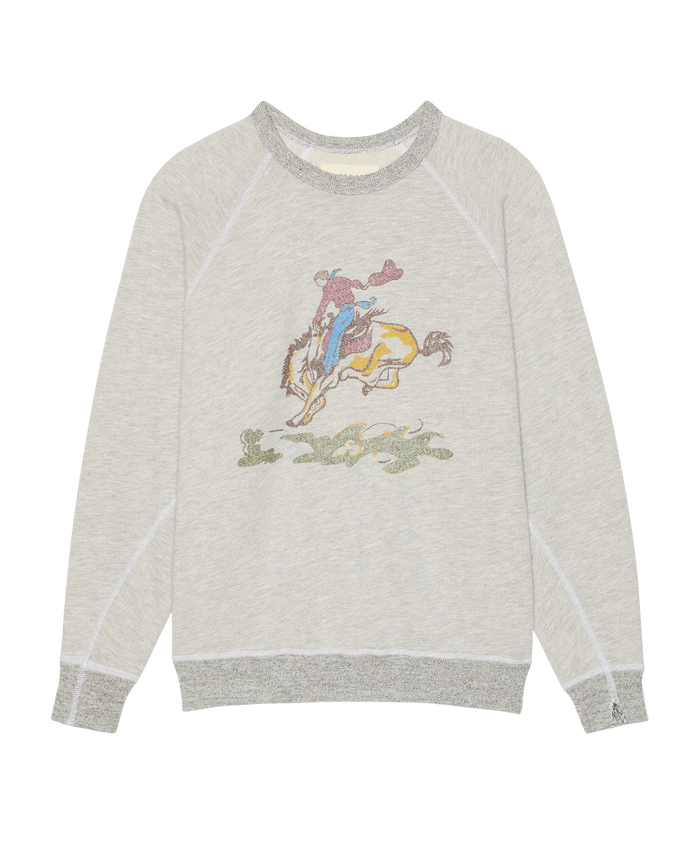 The College Sweatshirt w/ Rider Graphic by THE GREAT. in Soft Heather Grey features contrasting dark gray cuffs and collar, plus a striking graphic of a person on a yellow horse on the front.