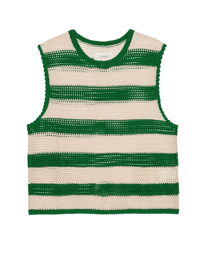 The Crochet Sweater Shell by THE GREAT. SU26 in Grove and Cream features sleeveless crochet design with horizontal green and beige stripes, shown laid flat on a white background.