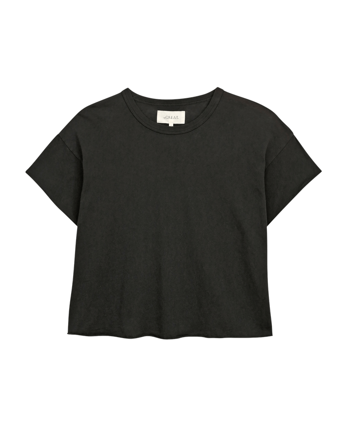 The Crop Tee in Almost Black by THE GREAT. CORE KNITS features a super soft cotton crew neck and short sleeves, shown on a plain background. It pairs perfectly with high-rise jeans for a stylish look.