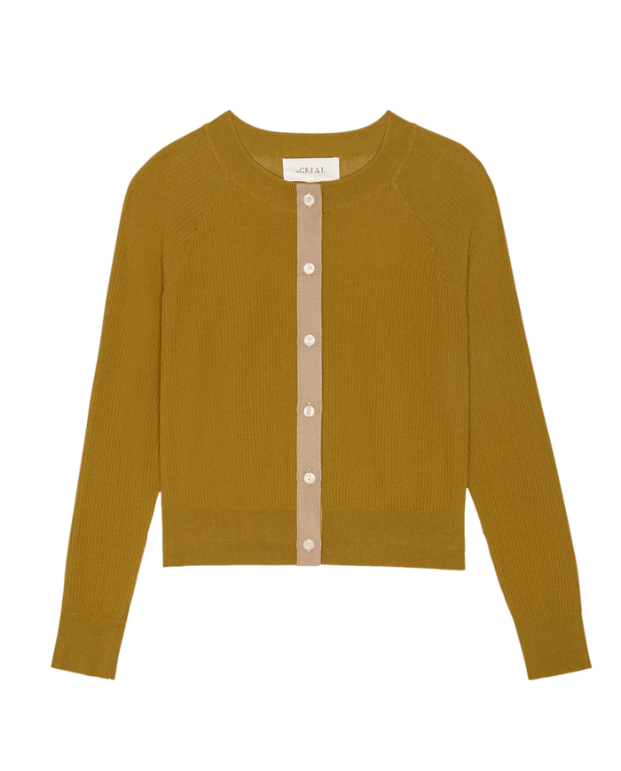 The Dainty Cardigan in Suntan by THE GREAT. SP26 D2 is a mustard yellow women's long-sleeve knit with beige trim and white buttons, displayed laid flat on a white background.
